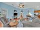 Comfortable living room featuring plush seating, wood floors and stylish decor at 466 Ashley Brooke Ct # C, Apopka, FL 32712