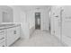 Well-lit bathroom showcases a glass shower, garden tub, and double sink vanity with granite counters at 4897 Gilded Jewel Dr, Mount Dora, FL 32757