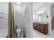 Upstairs bathroom features double vanity sinks, and a shower-tub combo at 4897 Gilded Jewel Dr, Mount Dora, FL 32757