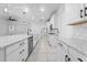 Elegant kitchen featuring white cabinetry, granite countertops and pendant lights at 4897 Gilded Jewel Dr, Mount Dora, FL 32757
