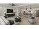 Open-concept living space featuring modern furnishings and a stylish kitchen at 4897 Gilded Jewel Dr, Mount Dora, FL 32757