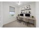 Bright office space with dual workstations, natural light, and stylish decor at 4897 Gilded Jewel Dr, Mount Dora, FL 32757
