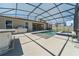 Screened-in pool area with a built-in bar perfect for entertaining at 4897 Gilded Jewel Dr, Mount Dora, FL 32757
