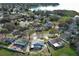 Aerial view of a home with a pool in a waterfront community at 5136 Stratemeyer Dr, Orlando, FL 32839