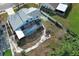 Aerial view of backyard with screened pool and white rock landscaping at 5136 Stratemeyer Dr, Orlando, FL 32839