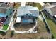 Aerial shot of a house with a screened-in pool, set in a neighborhood at 5136 Stratemeyer Dr, Orlando, FL 32839