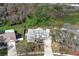 Aerial view of a two-story brick home surrounded by lush greenery and mature trees at 5136 Stratemeyer Dr, Orlando, FL 32839