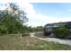Spacious backyard featuring a screened lanai and lush greenery, providing a private outdoor retreat at 5136 Stratemeyer Dr, Orlando, FL 32839