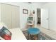 This is a cozy bedroom space showcasing closet, doorway and an easel for painting at 5136 Stratemeyer Dr, Orlando, FL 32839