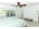 Spacious bedroom features light wood floors, and a ceiling fan at 5136 Stratemeyer Dr, Orlando, FL 32839