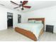 Bright bedroom with a ceiling fan and direct access to the walk-in closets at 5136 Stratemeyer Dr, Orlando, FL 32839