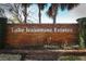 Lake Jessamine Estates brick community sign featuring mature landscaping and blue skies at 5136 Stratemeyer Dr, Orlando, FL 32839