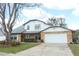 Spacious two-story home featuring a two-car garage and a well-manicured front yard at 5136 Stratemeyer Dr, Orlando, FL 32839
