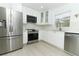 Bright kitchen with stainless steel appliances, sleek cabinets and a modern design at 5136 Stratemeyer Dr, Orlando, FL 32839
