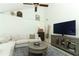 Open-concept living room with vaulted ceilings, modern decor, and ample natural light at 5136 Stratemeyer Dr, Orlando, FL 32839
