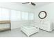 Bright living room featuring a ceiling fan and comfortable seating at 5136 Stratemeyer Dr, Orlando, FL 32839