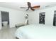 Main bedroom boasts a ceiling fan, an attached bathroom, and direct access to the walk-in closets at 5136 Stratemeyer Dr, Orlando, FL 32839
