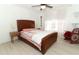 Bright main bedroom with hardwood floors, comfortable bed, and plenty of natural light at 5136 Stratemeyer Dr, Orlando, FL 32839