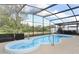 Backyard features pool with a spa and screened enclosure, offering a private outdoor oasis at 5136 Stratemeyer Dr, Orlando, FL 32839