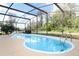 Inviting backyard pool with a spa and screened enclosure, perfect for relaxation and recreation at 5136 Stratemeyer Dr, Orlando, FL 32839
