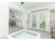 Sun room with tile floor and French doors leading to the outside at 5136 Stratemeyer Dr, Orlando, FL 32839