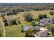 Lushly landscaped property aerial view showcases the screened lanai and peaceful, private setting at 777 Crepe Myrtle Cir, Apopka, FL 32712