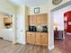 Butler's pantry featuring upper and lower cabinets, countertop appliances and views into other rooms at 777 Crepe Myrtle Cir, Apopka, FL 32712
