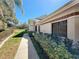 The exterior of the house with green and yellow landscaping, complemented by a neatly kept walkway at 777 Crepe Myrtle Cir, Apopka, FL 32712