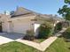 Exterior shot of home with landscaping and a screened-in lanai off to the side at 777 Crepe Myrtle Cir, Apopka, FL 32712