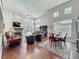 Spacious living room featuring a fireplace, high ceilings, and lots of natural light at 777 Crepe Myrtle Cir, Apopka, FL 32712