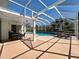 Inviting screened pool area with lounge chairs, patio table and chairs at 777 Crepe Myrtle Cir, Apopka, FL 32712