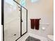 Walk-in shower featuring a glass door, white subway tiles, and chrome fixtures at 777 Crepe Myrtle Cir, Apopka, FL 32712