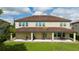 Expansive backyard with a covered patio, perfect for outdoor gatherings and relaxation at 8231 Chilton Dr, Orlando, FL 32836