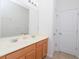 Bright bathroom features double sinks, wood cabinets, and a neutral color scheme at 8231 Chilton Dr, Orlando, FL 32836