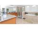 Well-lit bathroom featuring a soaking tub, walk-in shower, and dual sinks at 8231 Chilton Dr, Orlando, FL 32836