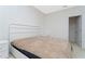 Bright bedroom features a walk-in closet, neutral color carpet, and modern white furniture at 8231 Chilton Dr, Orlando, FL 32836