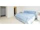 Large bedroom with a walk-in closet, neutral color carpet, a nightstand and a queen bed at 8231 Chilton Dr, Orlando, FL 32836