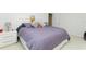 Comfortable bedroom with gray bedding, bedside table, and plush carpeting at 8231 Chilton Dr, Orlando, FL 32836