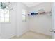 Spacious walk-in closet with built-in shelving and ample storage space at 8231 Chilton Dr, Orlando, FL 32836