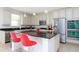 Modern kitchen with stainless steel appliances, granite countertops and breakfast bar seating at 8231 Chilton Dr, Orlando, FL 32836