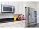 Modern kitchen showcasing stainless steel appliances, granite countertops, ample cabinetry, and decorative accents at 8231 Chilton Dr, Orlando, FL 32836