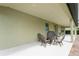 This covered patio includes seating around a fire pit, perfect for outdoor entertaining at 8231 Chilton Dr, Orlando, FL 32836