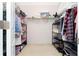 Large walk-in closet with extensive shelving and hanging storage for organization at 8231 Chilton Dr, Orlando, FL 32836