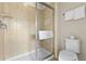 The bathroom has a shower and a toilet with a towel at 9026 Rhodes St, Kissimmee, FL 34747