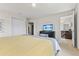 This bedroom has carpeted floor and view of the bathroom and walk-in closet at 9026 Rhodes St, Kissimmee, FL 34747