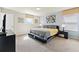 This bedroom has a queen-size bed with a gray and yellow comforter and decor with 2 bedside tables at 9026 Rhodes St, Kissimmee, FL 34747