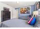 Marvel-themed bedroom with two twin beds, themed decor, and a large wall-mounted TV at 9026 Rhodes St, Kissimmee, FL 34747