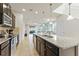 Modern kitchen with stainless steel appliances, granite countertops, and open access to the living areas at 9026 Rhodes St, Kissimmee, FL 34747