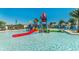 Fun-filled water park area with colorful slides, splash features, and lounging, perfect for Gathering entertainment at 9026 Rhodes St, Kissimmee, FL 34747