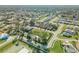 This neighborhood aerial view shows lush landscaping, ponds, residential areas, and manicured streets at 114 Tuscany Villas Dr, Edgewater, FL 32141